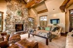 Stone fireplace and warm, inviting living room
